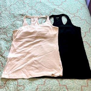 2 champion halter tank tops with built in support. Black and white size XL